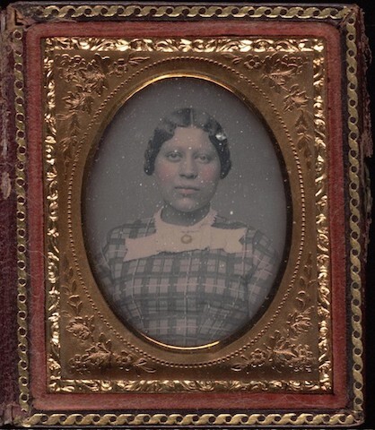 Daguerreotype of Lady in gingham dress facing forward