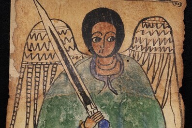 A detail of Ethiopic MSS 28 with an angel dressed in blue and green holding a sword in his right hand. 