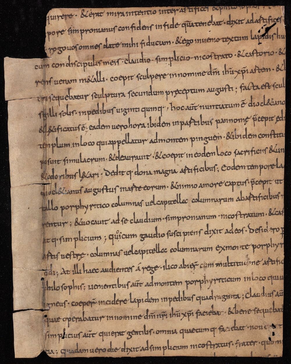 Single vellum manuscript page with dark writing, Latin script; signs of reuse as a binding fragment.