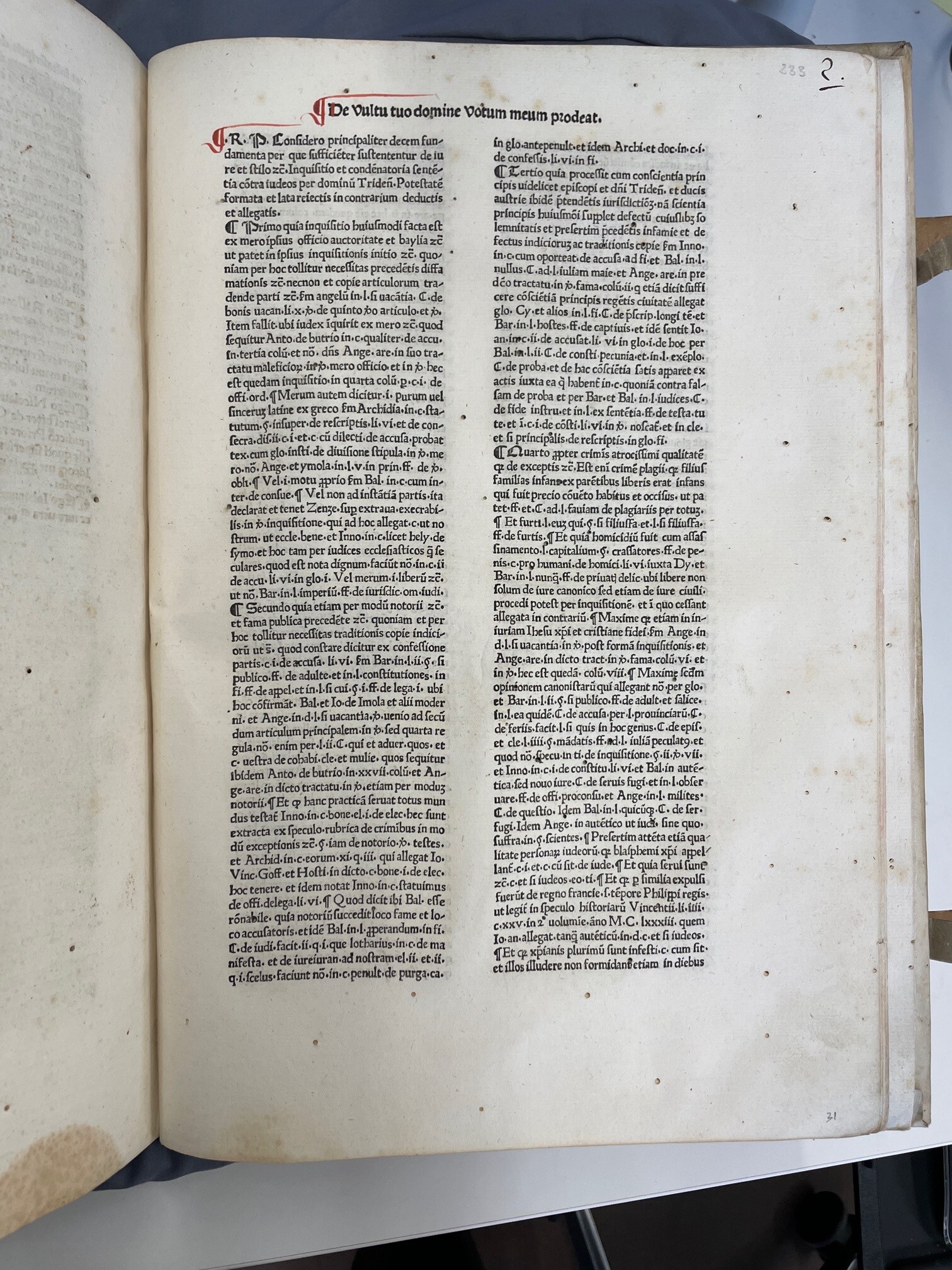 Single text page, two columns of type in Latin, wormholes, the beginning of de Pavinis' treatise on the ritual murder of Simon of Trent by the Jews.