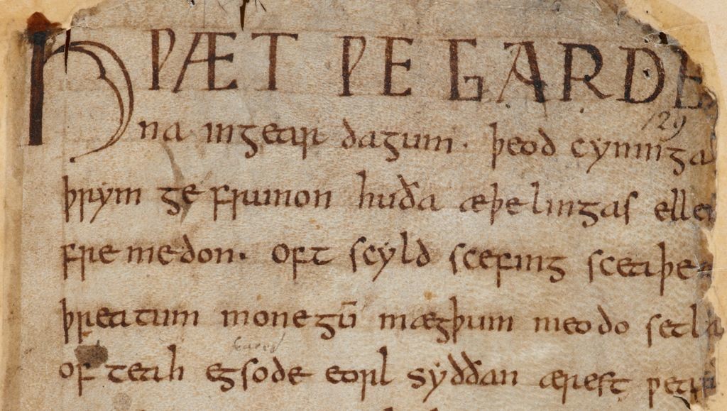 Image shows the first page of Beowulf in the manuscript damaged in the Cotton Fire.