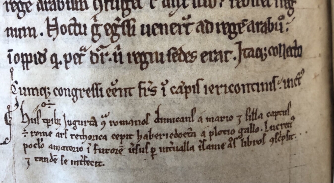 A close-up of a medieval manuscript page with text in black. 