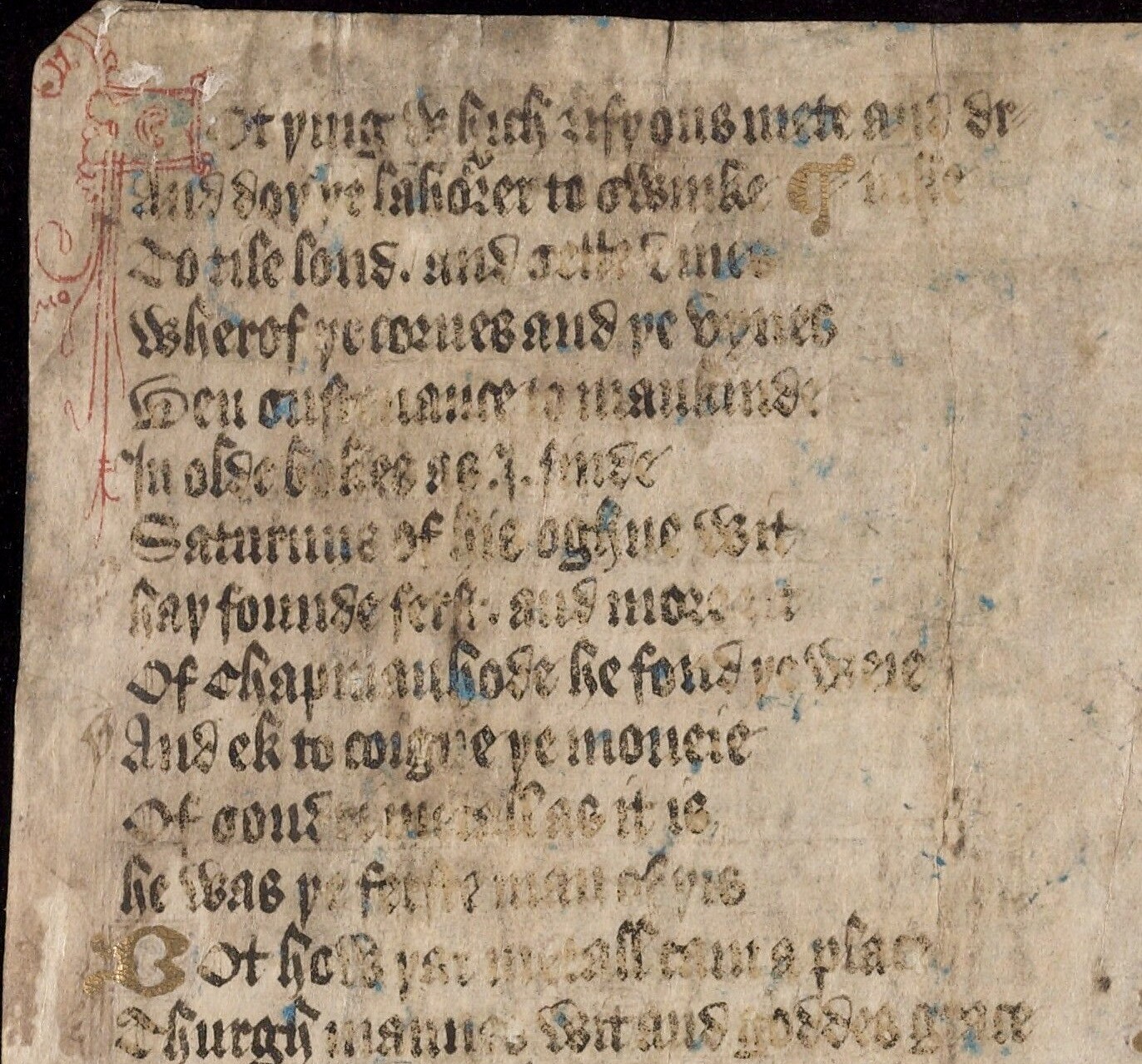 An image of a manuscript page with a rubricated initial and black text in gothic script.